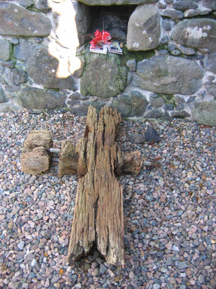 A very old wooden boundary cross