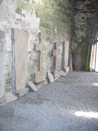 Crosses and slabs inside St Caimin's