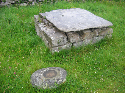 Outside altar with Bullaun